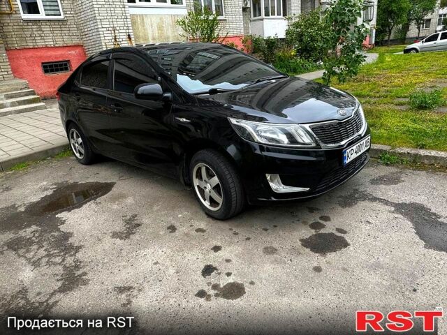 Черный Киа Рио, объемом двигателя 1.6 л и пробегом 330 тыс. км за 5700 $, фото 1 на Automoto.ua