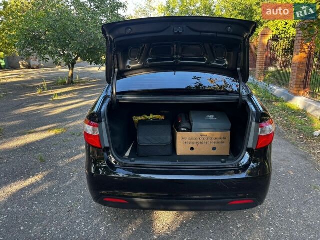 Чорний Кіа Ріо, об'ємом двигуна 1.4 л та пробігом 165 тис. км за 6900 $, фото 30 на Automoto.ua