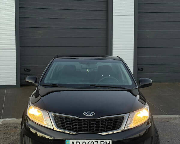 Чорний Кіа Ріо, об'ємом двигуна 1.4 л та пробігом 136 тис. км за 6900 $, фото 1 на Automoto.ua
