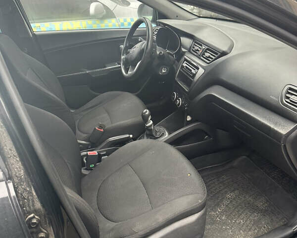 Чорний Кіа Ріо, об'ємом двигуна 1.4 л та пробігом 100 тис. км за 3500 $, фото 5 на Automoto.ua