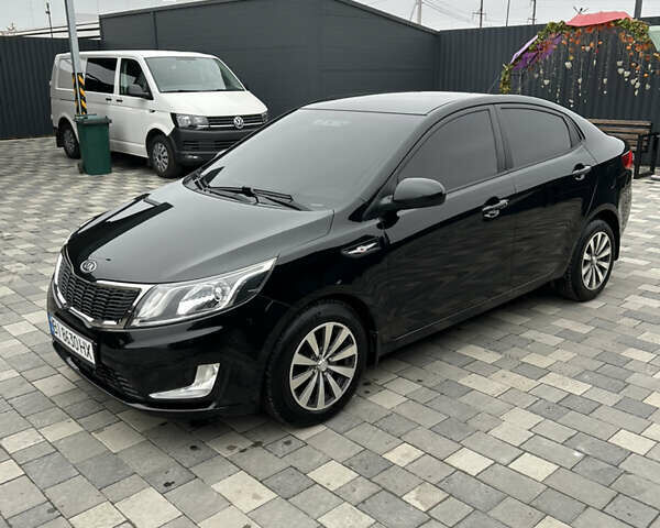 Черный Киа Рио, объемом двигателя 1.4 л и пробегом 111 тыс. км за 7500 $, фото 1 на Automoto.ua
