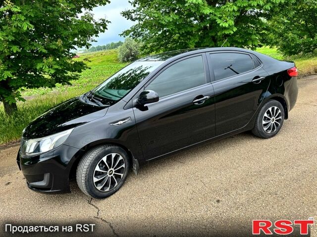 Черный Киа Рио, объемом двигателя 1.4 л и пробегом 131 тыс. км за 7500 $, фото 1 на Automoto.ua