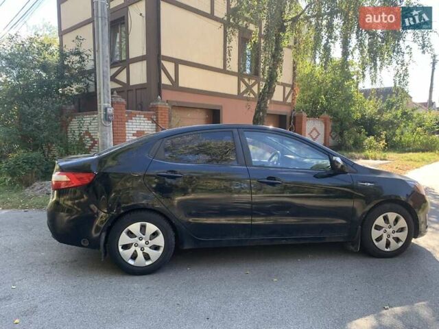 Чорний Кіа Ріо, об'ємом двигуна 1.4 л та пробігом 146 тис. км за 5075 $, фото 1 на Automoto.ua
