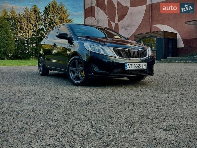 Чорний Кіа Ріо, об'ємом двигуна 1.4 л та пробігом 95 тис. км за 7300 $, фото 3 на Automoto.ua