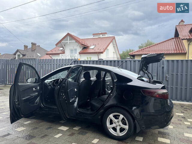 Чорний Кіа Ріо, об'ємом двигуна 1.4 л та пробігом 199 тис. км за 5999 $, фото 24 на Automoto.ua