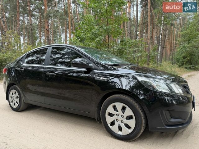 Чорний Кіа Ріо, об'ємом двигуна 1.4 л та пробігом 193 тис. км за 6300 $, фото 1 на Automoto.ua