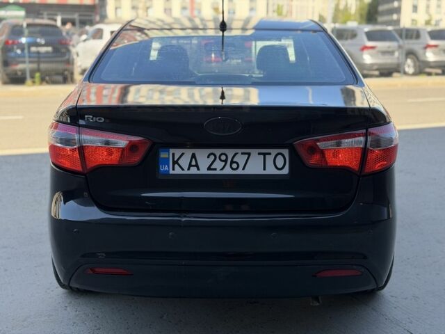 Чорний Кіа Ріо, об'ємом двигуна 1.4 л та пробігом 201 тис. км за 6948 $, фото 3 на Automoto.ua