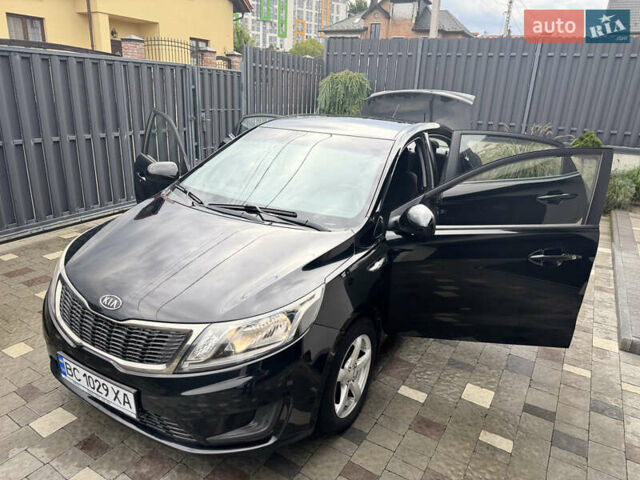 Чорний Кіа Ріо, об'ємом двигуна 1.4 л та пробігом 199 тис. км за 5999 $, фото 23 на Automoto.ua