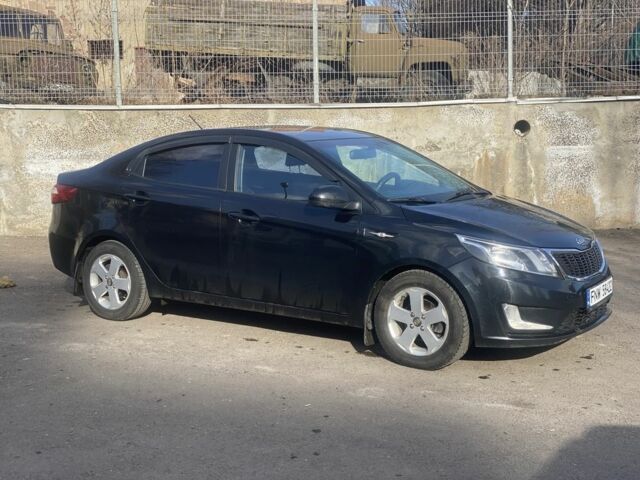Чорний Кіа Ріо, об'ємом двигуна 1.6 л та пробігом 252 тис. км за 3650 $, фото 3 на Automoto.ua