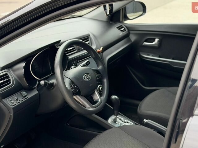 Чорний Кіа Ріо, об'ємом двигуна 1.4 л та пробігом 202 тис. км за 6900 $, фото 9 на Automoto.ua