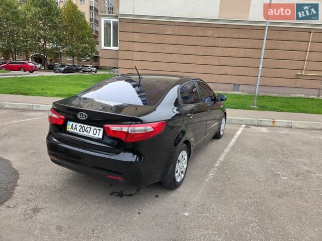 Чорний Кіа Ріо, об'ємом двигуна 1.6 л та пробігом 215 тис. км за 7500 $, фото 2 на Automoto.ua