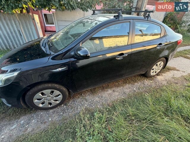 Чорний Кіа Ріо, об'ємом двигуна 1.4 л та пробігом 73 тис. км за 8900 $, фото 3 на Automoto.ua