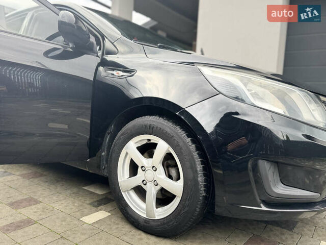 Чорний Кіа Ріо, об'ємом двигуна 1.4 л та пробігом 199 тис. км за 5999 $, фото 32 на Automoto.ua