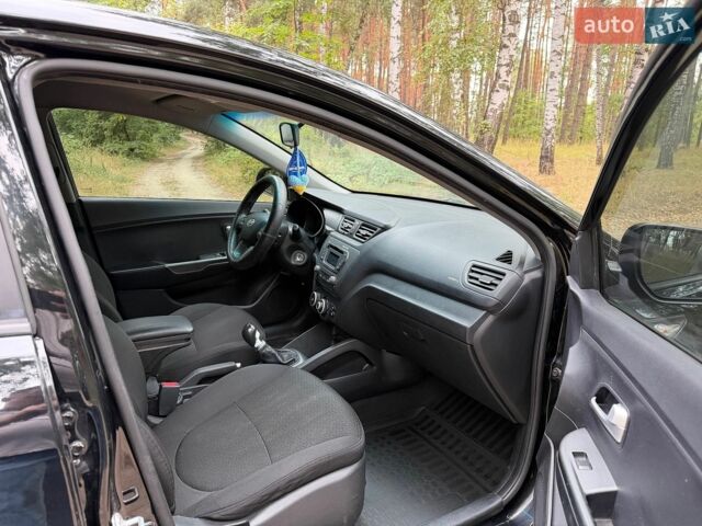 Чорний Кіа Ріо, об'ємом двигуна 1.4 л та пробігом 193 тис. км за 6300 $, фото 19 на Automoto.ua