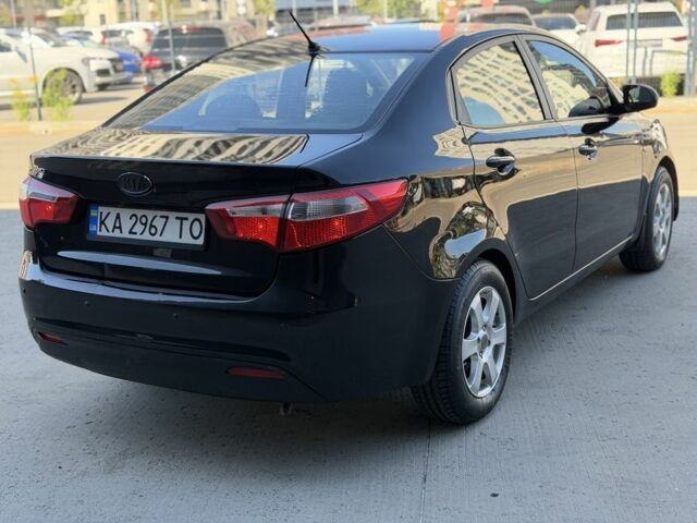 Чорний Кіа Ріо, об'ємом двигуна 1.4 л та пробігом 201 тис. км за 6948 $, фото 4 на Automoto.ua