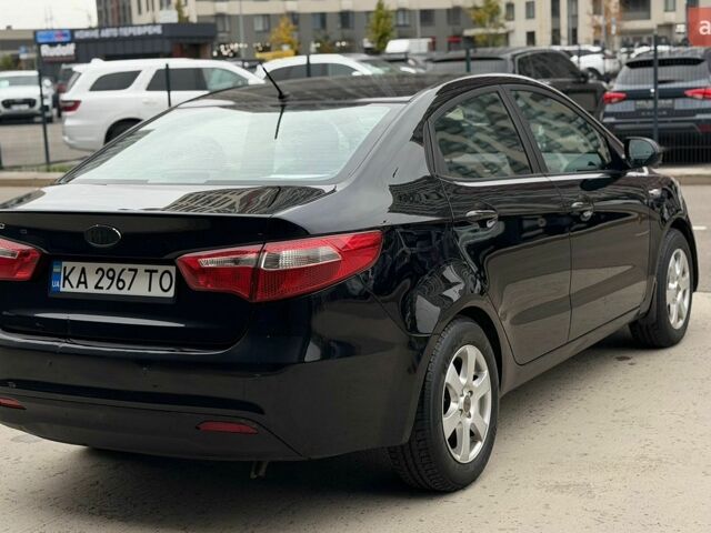 Чорний Кіа Ріо, об'ємом двигуна 1.4 л та пробігом 202 тис. км за 6900 $, фото 4 на Automoto.ua
