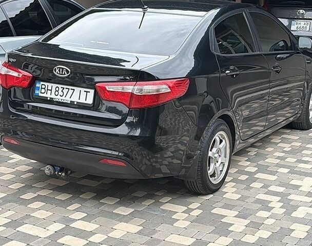 Чорний Кіа Ріо, об'ємом двигуна 1.6 л та пробігом 104 тис. км за 8500 $, фото 13 на Automoto.ua