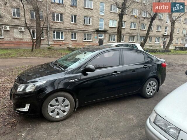 Чорний Кіа Ріо, об'ємом двигуна 1.4 л та пробігом 154 тис. км за 7500 $, фото 4 на Automoto.ua