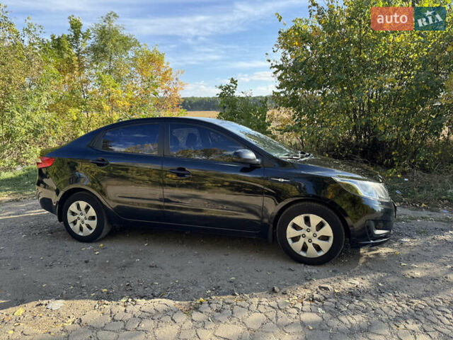 Черный Киа Рио, объемом двигателя 1.4 л и пробегом 173 тыс. км за 7300 $, фото 6 на Automoto.ua