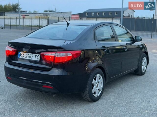 Чорний Кіа Ріо, об'ємом двигуна 1.4 л та пробігом 201 тис. км за 6950 $, фото 4 на Automoto.ua
