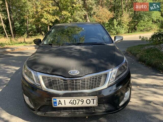 Чорний Кіа Ріо, об'ємом двигуна 1.4 л та пробігом 146 тис. км за 5075 $, фото 5 на Automoto.ua