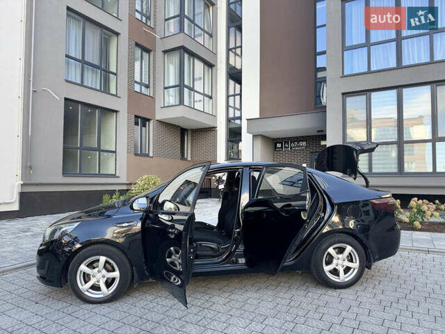 Чорний Кіа Ріо, об'ємом двигуна 1.4 л та пробігом 199 тис. км за 5950 $, фото 19 на Automoto.ua