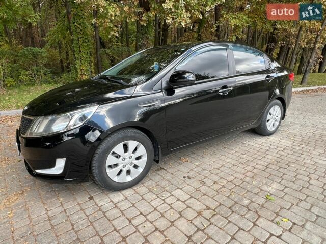 Черный Киа Рио, объемом двигателя 1.59 л и пробегом 160 тыс. км за 8100 $, фото 1 на Automoto.ua