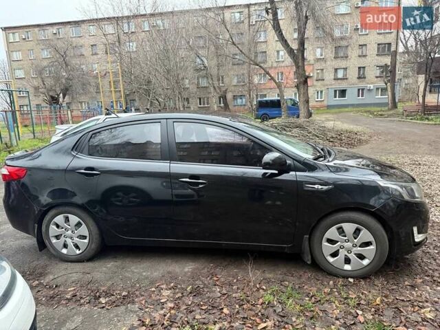 Чорний Кіа Ріо, об'ємом двигуна 1.4 л та пробігом 154 тис. км за 7500 $, фото 3 на Automoto.ua
