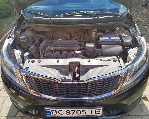 Чорний Кіа Ріо, об'ємом двигуна 1.4 л та пробігом 95 тис. км за 7000 $, фото 5 на Automoto.ua