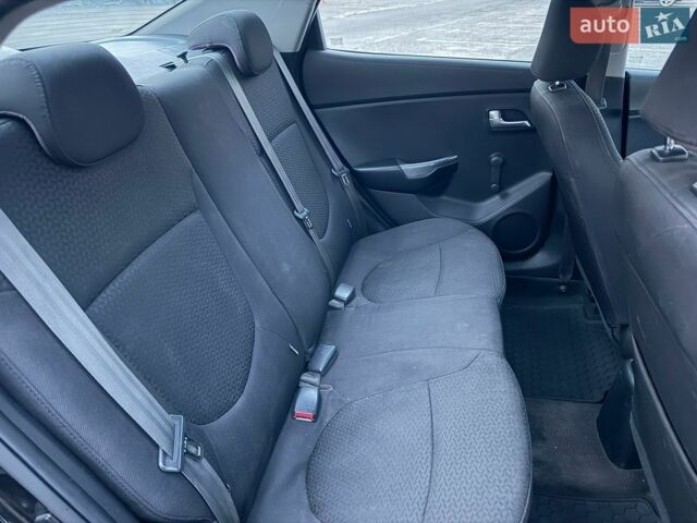 Чорний Кіа Ріо, об'ємом двигуна 1.4 л та пробігом 201 тис. км за 6950 $, фото 22 на Automoto.ua