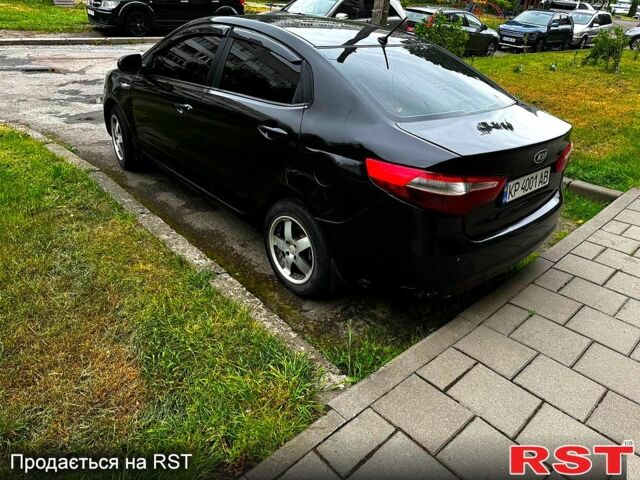 Черный Киа Рио, объемом двигателя 1.6 л и пробегом 330 тыс. км за 5700 $, фото 4 на Automoto.ua