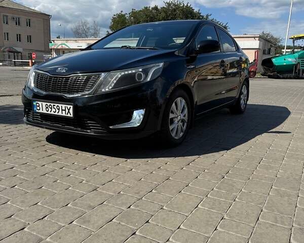 Чорний Кіа Ріо, об'ємом двигуна 1.4 л та пробігом 158 тис. км за 8300 $, фото 1 на Automoto.ua