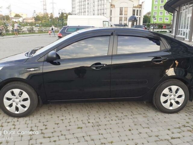 Чорний Кіа Ріо, об'ємом двигуна 1.4 л та пробігом 80 тис. км за 8700 $, фото 5 на Automoto.ua