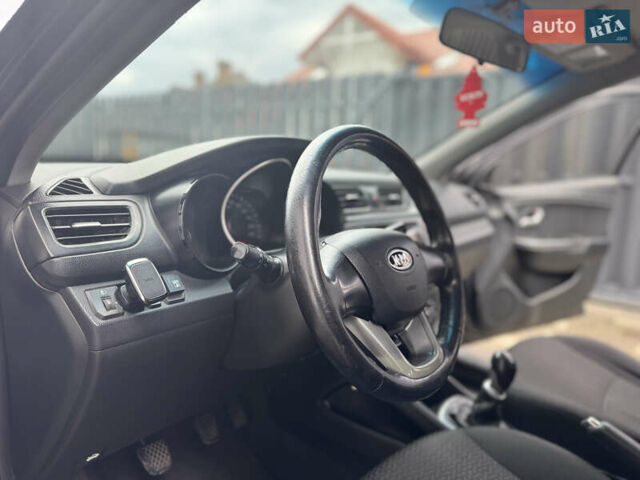 Чорний Кіа Ріо, об'ємом двигуна 1.4 л та пробігом 199 тис. км за 5999 $, фото 14 на Automoto.ua