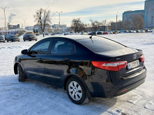 Чорний Кіа Ріо, об'ємом двигуна 1.6 л та пробігом 270 тис. км за 6499 $, фото 1 на Automoto.ua