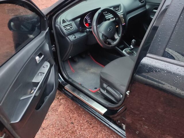 Чорний Кіа Ріо, об'ємом двигуна 1.4 л та пробігом 170 тис. км за 8500 $, фото 10 на Automoto.ua