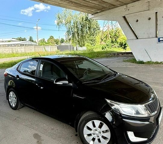 Черный Киа Рио, объемом двигателя 1.59 л и пробегом 204 тыс. км за 7000 $, фото 1 на Automoto.ua