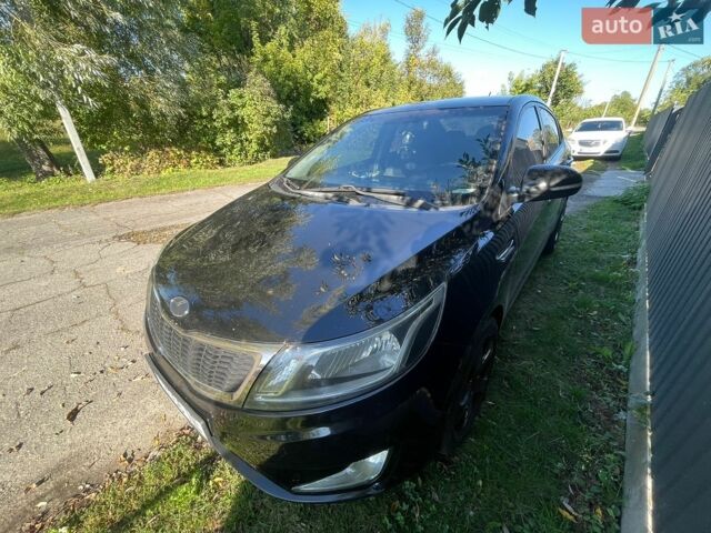 Чорний Кіа Ріо, об'ємом двигуна 1.59 л та пробігом 274 тис. км за 7500 $, фото 1 на Automoto.ua