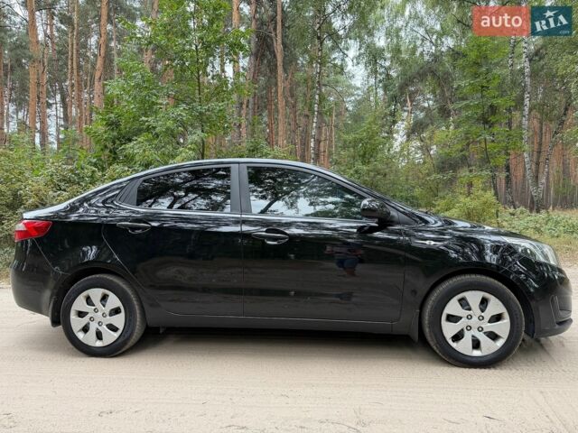 Чорний Кіа Ріо, об'ємом двигуна 1.4 л та пробігом 193 тис. км за 6300 $, фото 4 на Automoto.ua