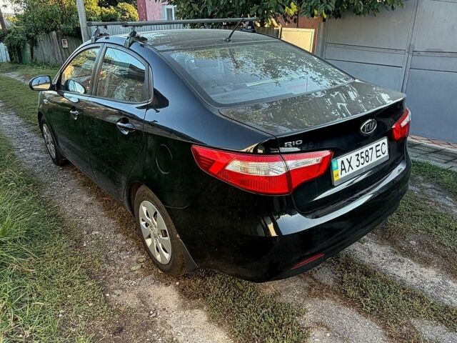 Чорний Кіа Ріо, об'ємом двигуна 1.4 л та пробігом 73 тис. км за 8900 $, фото 5 на Automoto.ua