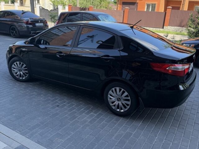 Чорний Кіа Ріо, об'ємом двигуна 1.4 л та пробігом 103 тис. км за 7999 $, фото 5 на Automoto.ua