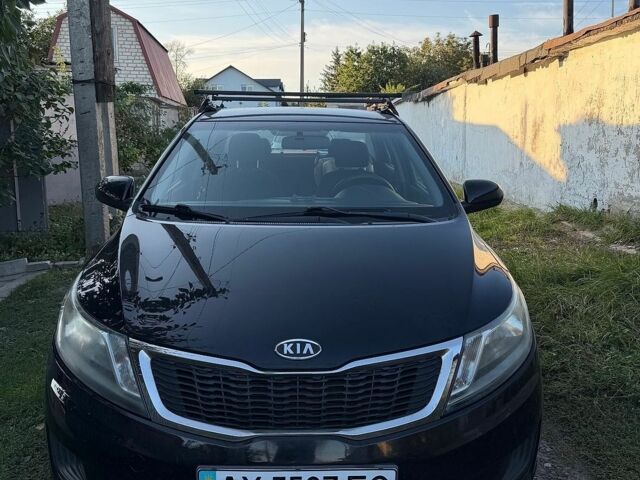 Чорний Кіа Ріо, об'ємом двигуна 1.4 л та пробігом 73 тис. км за 8900 $, фото 1 на Automoto.ua