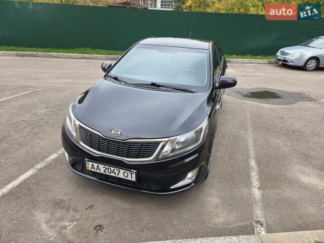 Чорний Кіа Ріо, об'ємом двигуна 1.6 л та пробігом 215 тис. км за 7500 $, фото 3 на Automoto.ua