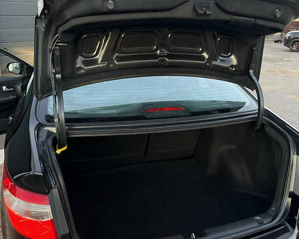 Чорний Кіа Ріо, об'ємом двигуна 1.4 л та пробігом 136 тис. км за 6900 $, фото 8 на Automoto.ua