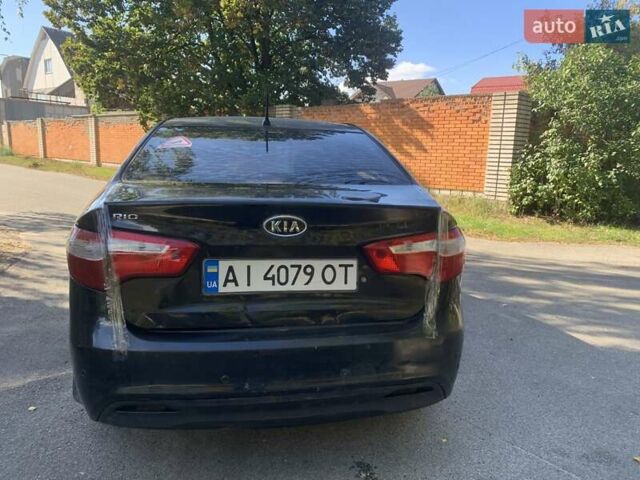 Чорний Кіа Ріо, об'ємом двигуна 1.4 л та пробігом 146 тис. км за 5075 $, фото 4 на Automoto.ua