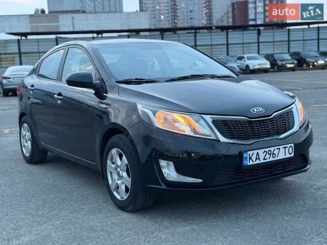 Чорний Кіа Ріо, об'ємом двигуна 1.4 л та пробігом 201 тис. км за 6950 $, фото 6 на Automoto.ua