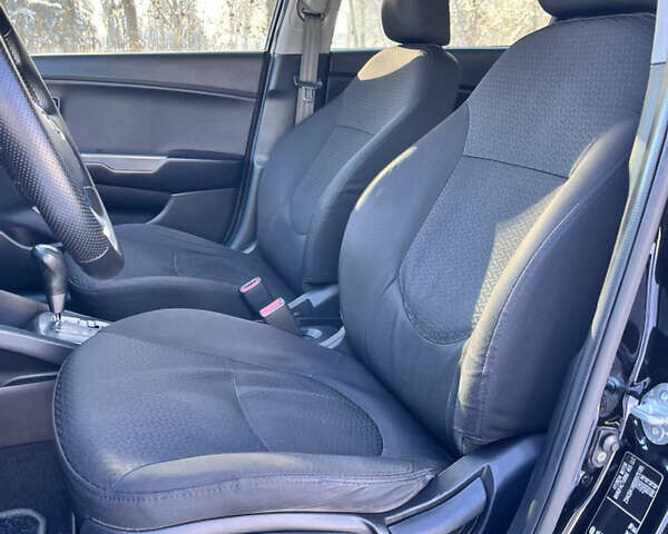 Чорний Кіа Ріо, об'ємом двигуна 1.4 л та пробігом 245 тис. км за 7600 $, фото 23 на Automoto.ua