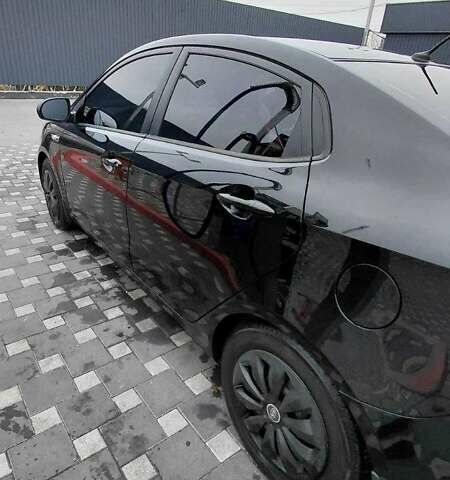 Чорний Кіа Ріо, об'ємом двигуна 1.4 л та пробігом 100 тис. км за 7607 $, фото 2 на Automoto.ua