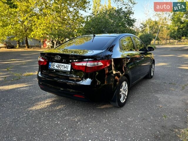 Чорний Кіа Ріо, об'ємом двигуна 1.4 л та пробігом 165 тис. км за 7900 $, фото 6 на Automoto.ua