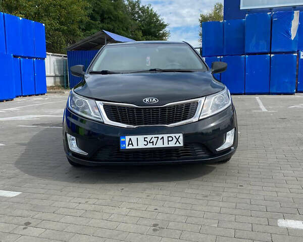 Чорний Кіа Ріо, об'ємом двигуна 1.4 л та пробігом 100 тис. км за 5999 $, фото 5 на Automoto.ua